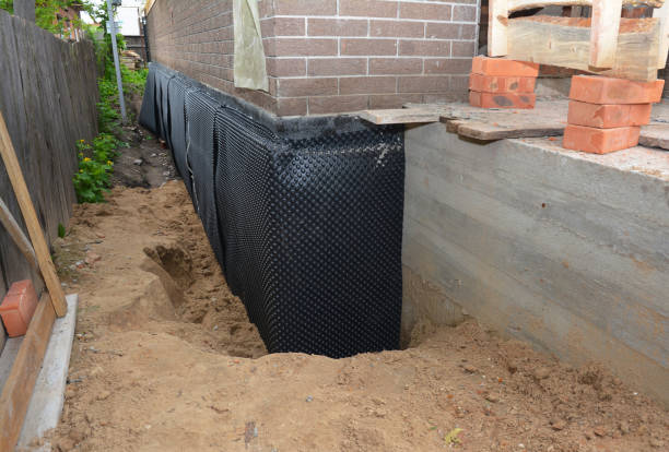 Happy homeowners after waterproofing job in Vevay